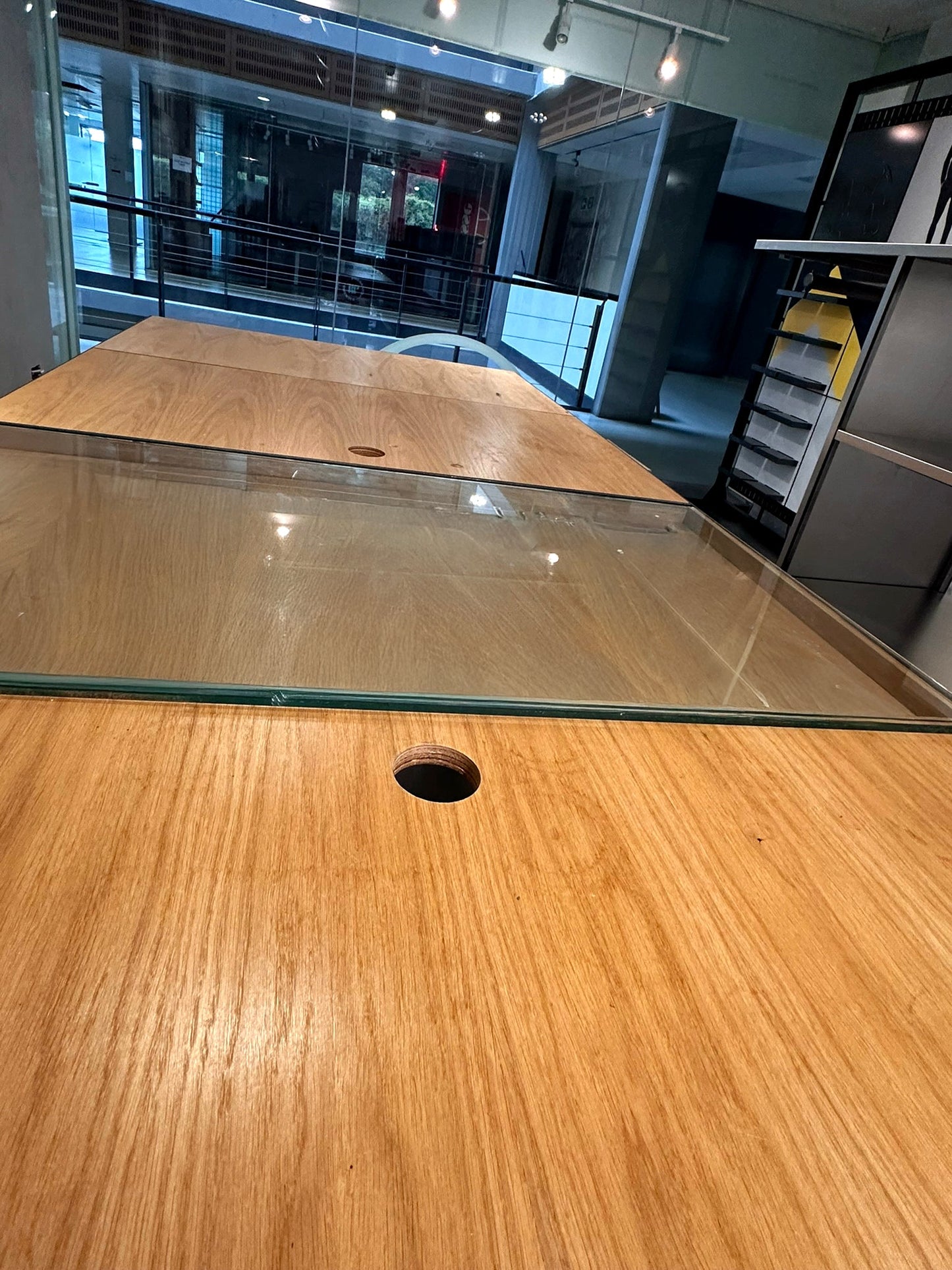 Long Plywood and steel table with display section