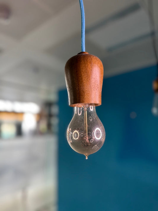 Minimal wooden light sockets with different coloured chords