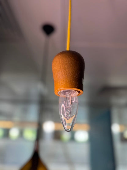 Minimal wooden light sockets with different coloured chords