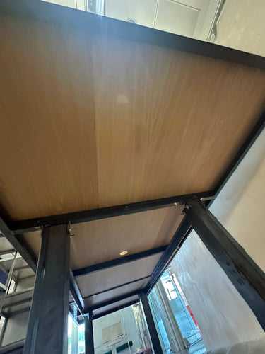 Long Plywood and steel table with display section