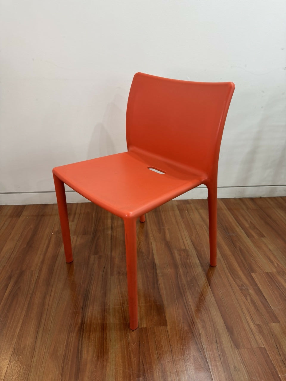 orange-stackable-chair-angled
